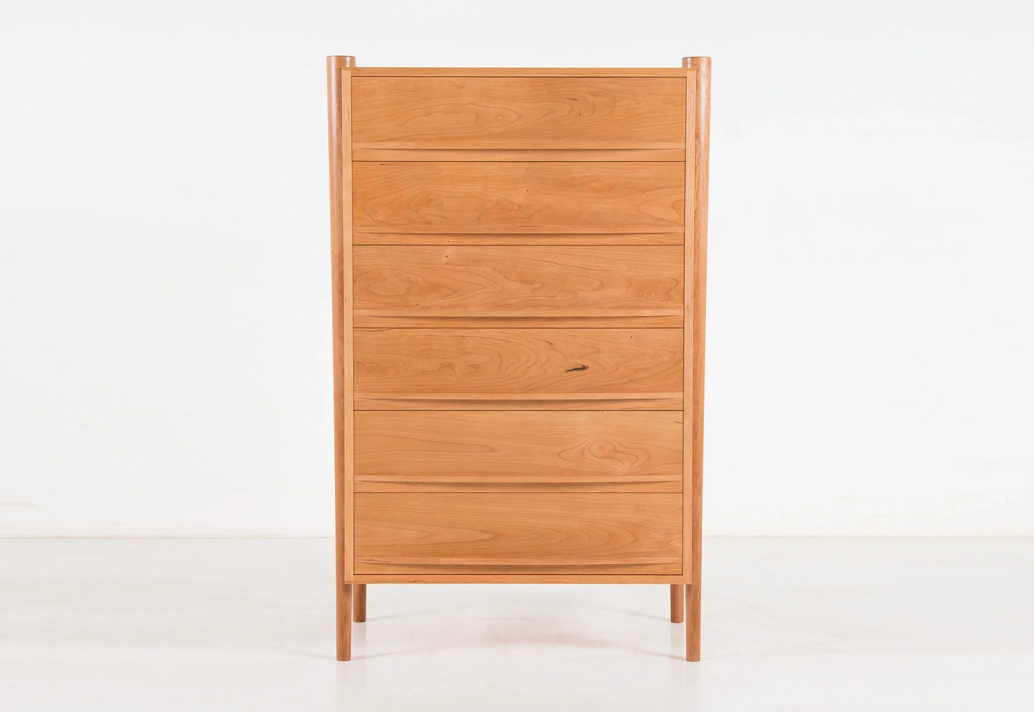 Dresser - Vertical - From its tapered legs and exposed end grain to its elliptical drawer pulls, the is confident in