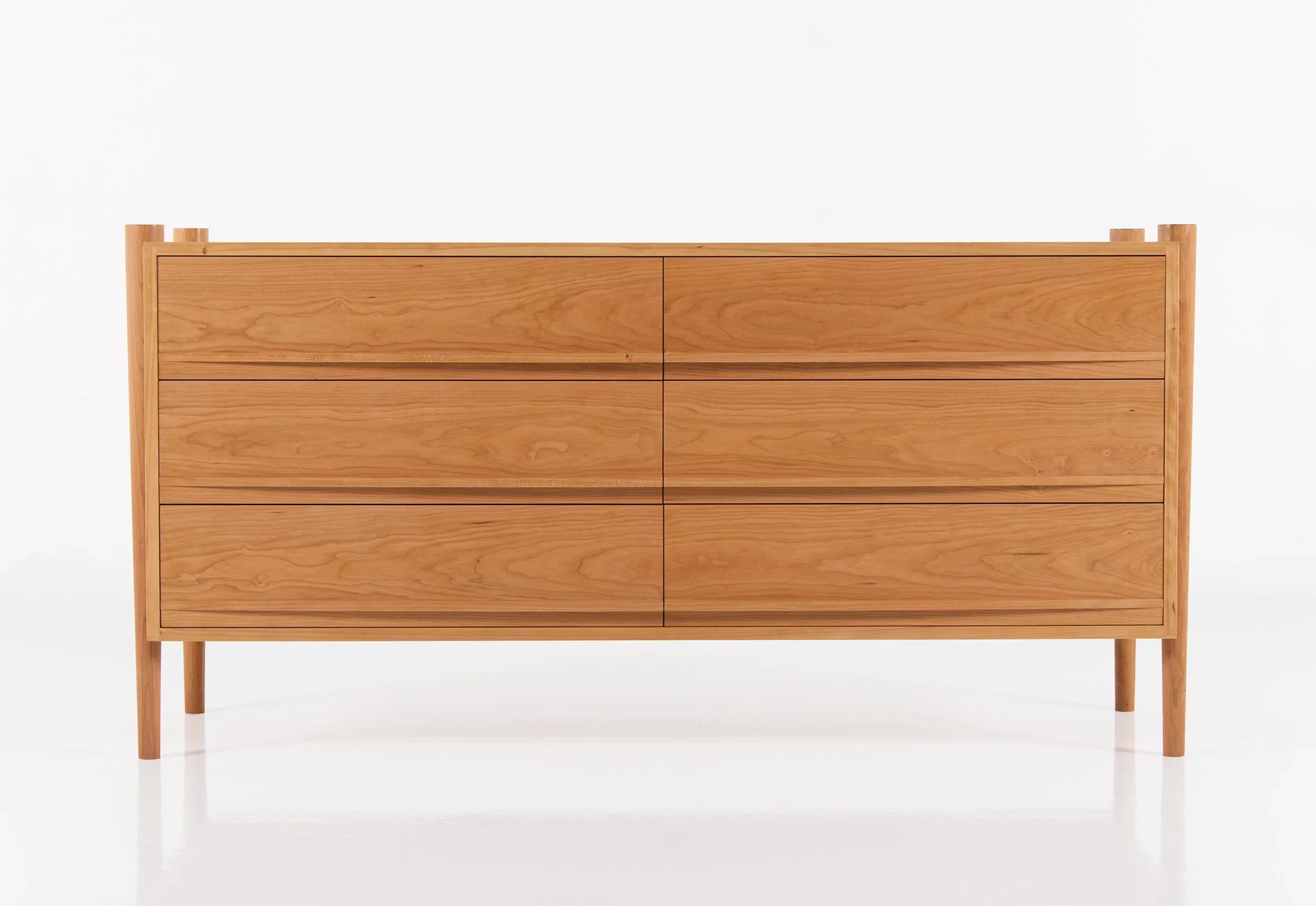 Dresser - Horizontal - From its tapered legs and exposed end grain to its elliptical drawer pulls, the is confident in