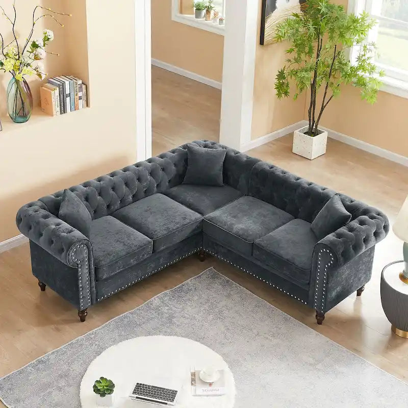 L-shaped sofa with deep-stitched details and curled armrests.